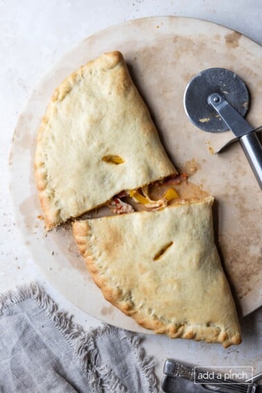 Homemade calzone on a pizza stone.