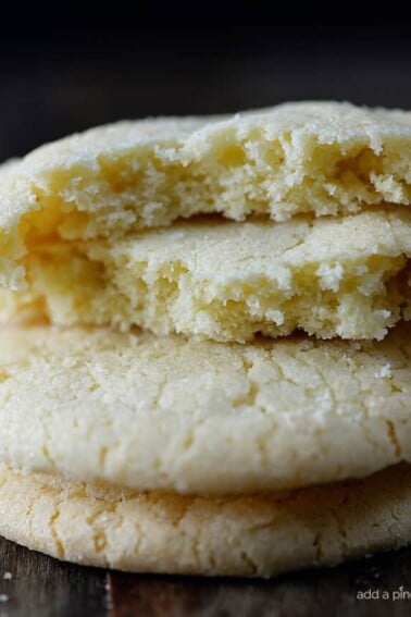 Absolutely the BEST sugar cookie recipe I’ve ever tasted! These sugar cookies are soft, chewy and produce a flavorful bakery style soft sugar cookie! Quick and easy to make, this sugar cookie recipe makes cookies that turn out perfectly every single time! // addapinch.com