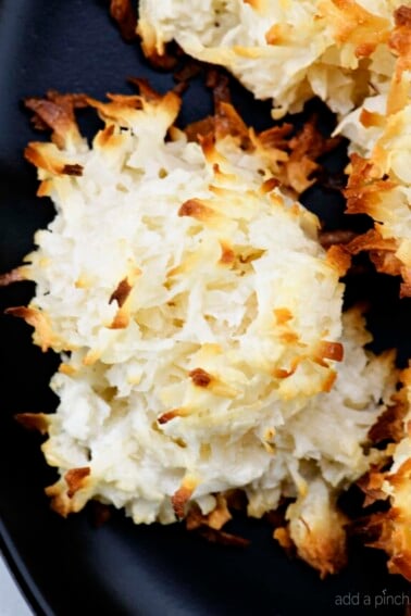 Easy Coconut Macaroons Recipe - These easy coconut macaroons are made with just five ingredients. Golden brown, they are light, chewy and filled with flavorful coconut! // addapinch.com