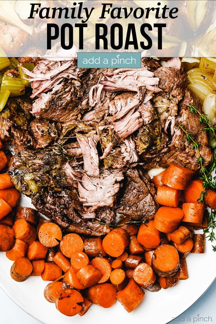 Pot Roast on platter surrounded by carrots, potatoes, celery, onions - with text - addapinch.com