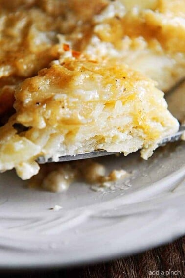 Scalloped Potatoes Recipe - This easy scalloped potatoes recipe is so creamy, cheesy, and out of this world delicious!  // addapinch.com