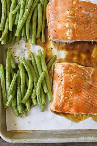 Sheet Pan Teriyaki Salmon with Green Beans Recipe - This Sheet Pan Teriyaki Salmon with Green Beans recipe comes together in a snap! Ready and on the table in less than 30 minutes, it is a definite family favorite meal! // addapinch.com