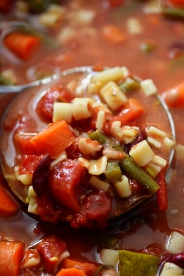 This savory Slow Cooker Minestrone Soup Recipe is full of seasonal vegetables and made even easier in this slow cooker recipe! A delicious family favorite!// addapinch.com